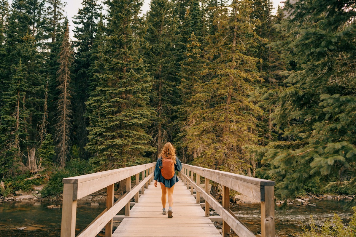 Teen crossing a bridge