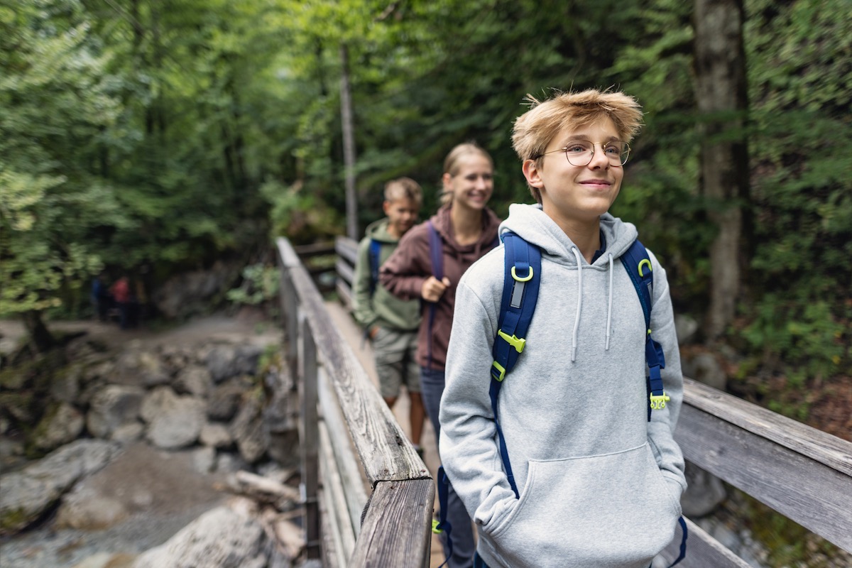 Teens hiking with leader