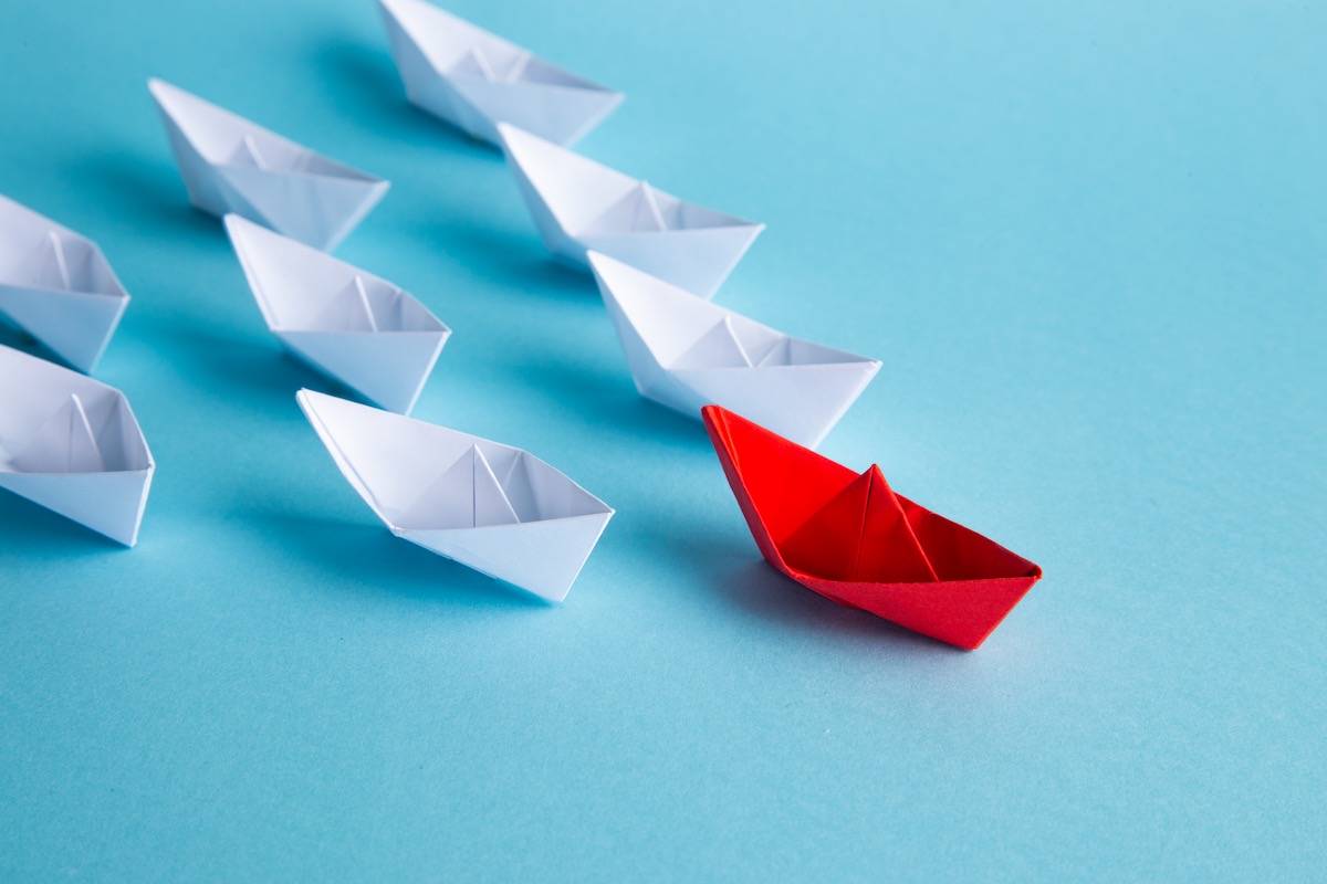 Red boat leading others